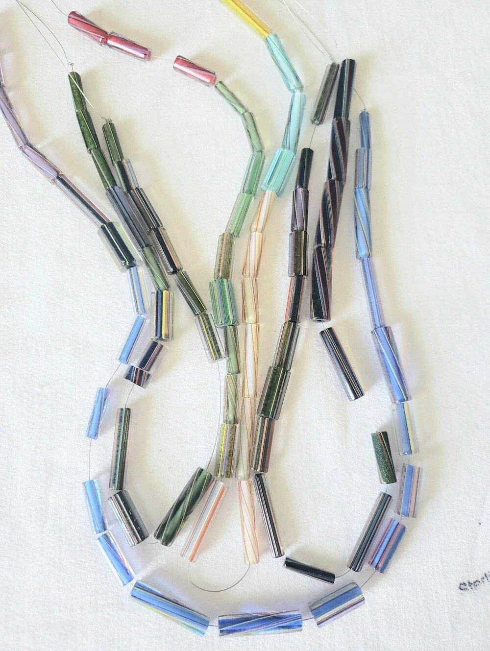 80 hand-drawn glass tube beads